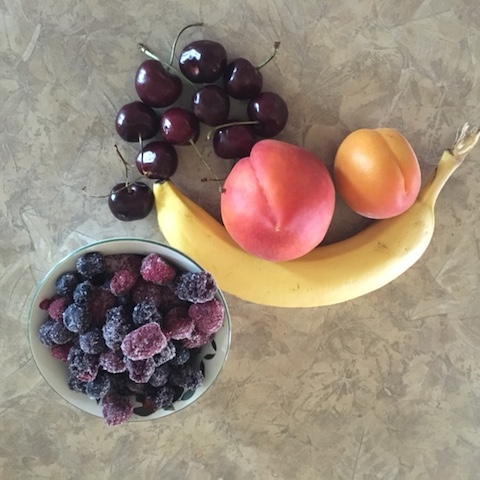 Cherries, berries, peaches, an apricot, a banana, and a peach. Whirr and enjoy!