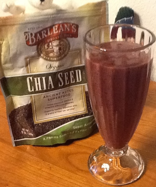 chia seeds along with other ingredients help keep pain away in this maroon smoothie served in a fluted soda glass