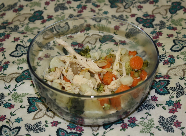 In a clear bowl, serve steamed veggies with added cooked chicken. eat hot or cold - delicious