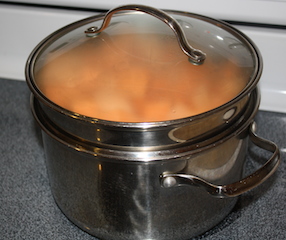 sweet potatoes steam in in a pot