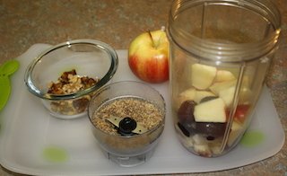 an apple, flaxseed, walnuts, dates - just some of the ingredients to make a yummy walnut topped smoothie