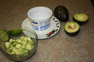 picture shows  first step in making an avocado fish salad, how to make avocado container