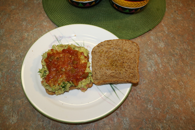 Add drained healthy salsa on top of the guacamole to make a healthy to eat sandwich