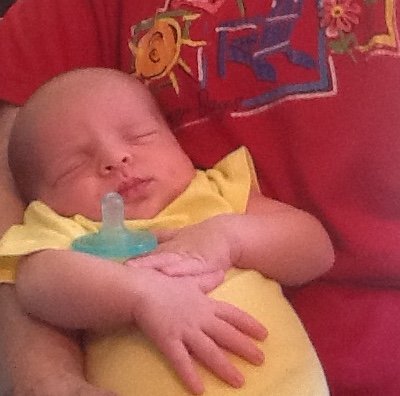 A baby can sleep well when held in a comfortable position in someones arms.