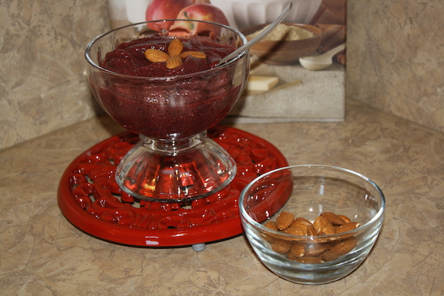 A creamy almond topped colorful fruit sorbet for breakfast or anytime