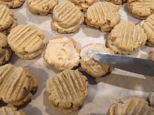 Putting icing on the cookies