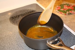 combined curry and butter blended in a pan waiting for addition of chicken broth