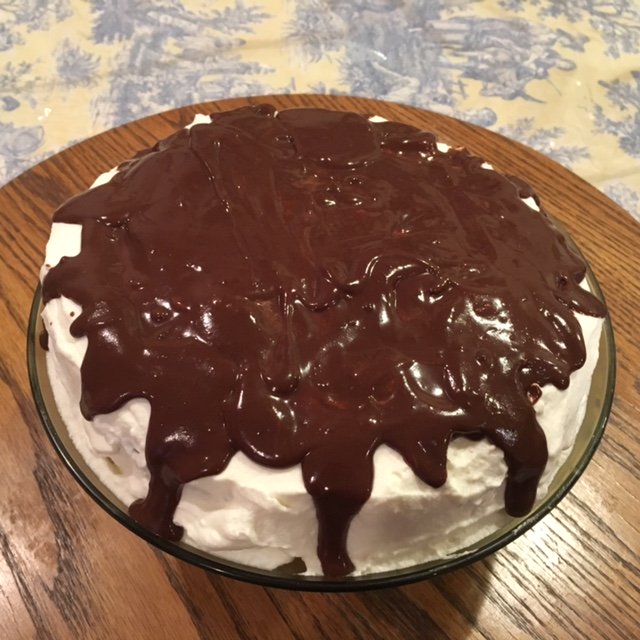 This is a very tasty cake. Pecans replace the flour. It is topped with cream and a delicious chocolate glaze.