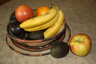 A bowl of fruit including avocados can help you have lower cholesterol