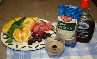 bananas, spinach, oranges or tangerines, strawberries and spinach ready to be blended with some flaxseed and chia