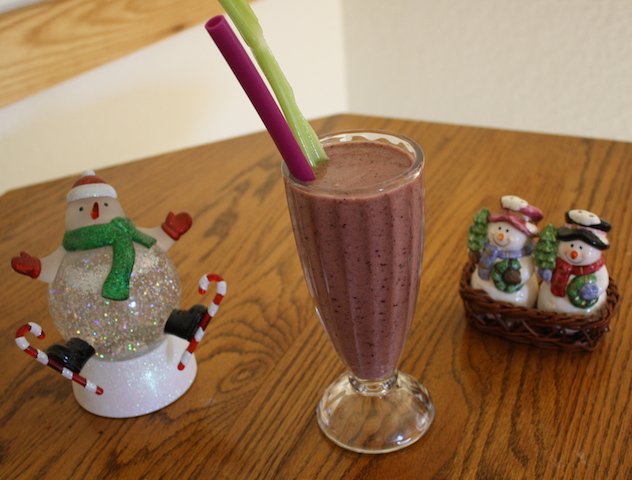 colorful pineapple berry smoothie with snowmen ceramics