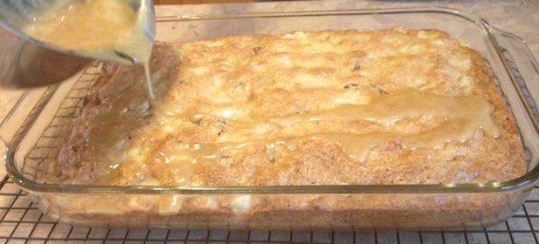 Adding glaze to the pear cake - yum