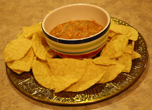 A bowlful of healthy salsa with chips makes a good appetizer or snack.