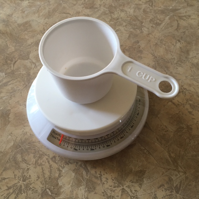 Put an empty cup on the scale and set it to zero before adding ingredients