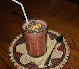 A pink smoothie topped with walnuts and chia seeds makes a delicious breakfast-full of antioxidants and anti-inflammatory ingredients