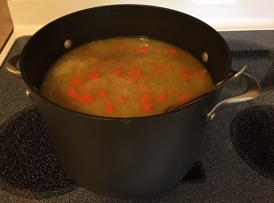 homemade soup simmering on the stove