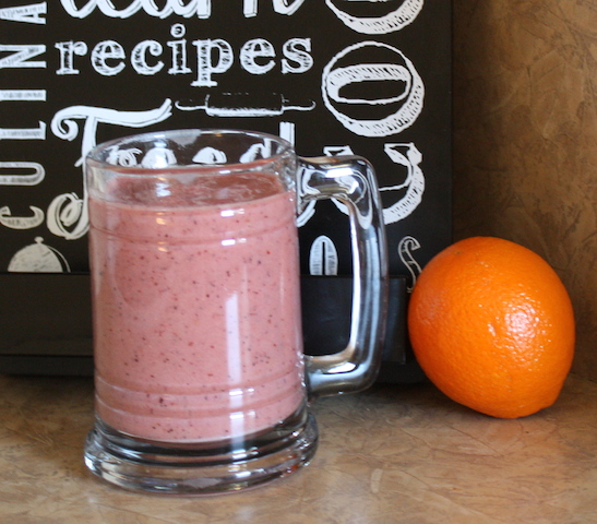 A pink smoothie served in a mug makes a healthy addition to a cholesterol lowering diet