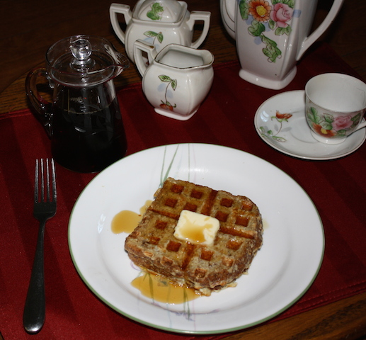A delicious wafflette with butter and syrup